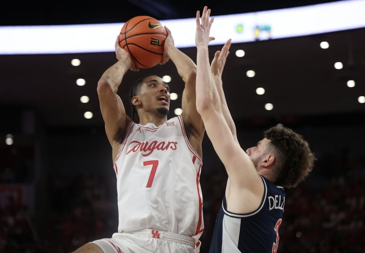 Feb 21, 2026; Houston, Texas, USA;  Houston Cougars guard Milos Uzan (7) shoots against Arizona Wildcats guard Anthony Dell'orso (3) in the second half at Fertitta Center. Mandatory Credit: Thomas Shea-Imagn Images