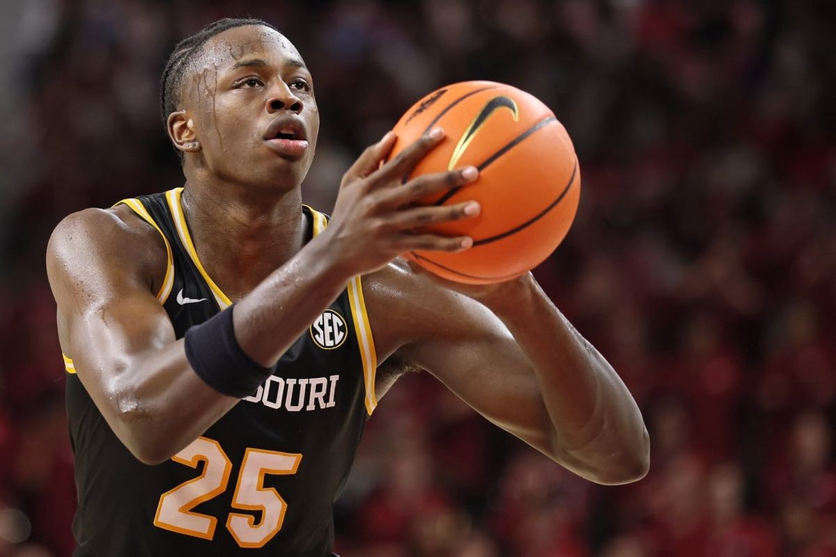 Feb 21, 2026; Fayetteville, Arkansas, USA; Missouri Tigers guard Mark Mitchell (25) shoots a free-throw during the second half against the Arkansas Razorbacks at Bud Walton Arena. Arkansas won 94-86. Mandatory Credit: Nelson Chenault-Imagn Images