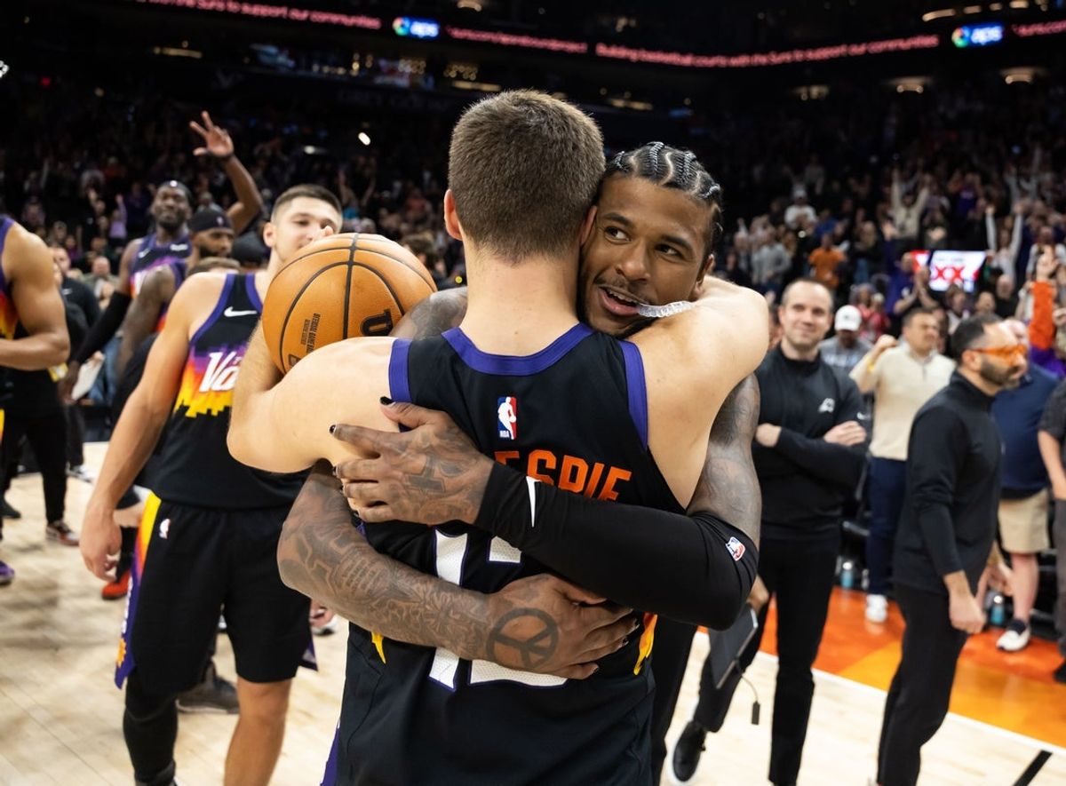 Feb 21, 2026; Phoenix, Arizona, USA; Phoenix Suns guard Jalen Green (4) celebrates with Collin Gillespie (12) after defeating the Orlando Magic in double overtime at Mortgage Matchup Center. Mandatory Credit: Mark J. Rebilas-Imagn Images