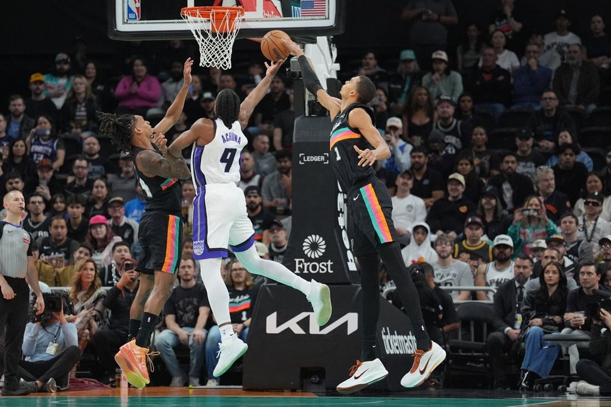 Feb 21, 2026; Austin, Texas, USA;  San Antonio Spurs forward Victor Wembanyama (1) blocks a shot by Sacramento Kings forward Precious Achiuwa (9) in the first half at Moody Center. Mandatory Credit: Daniel Dunn-Imagn Images