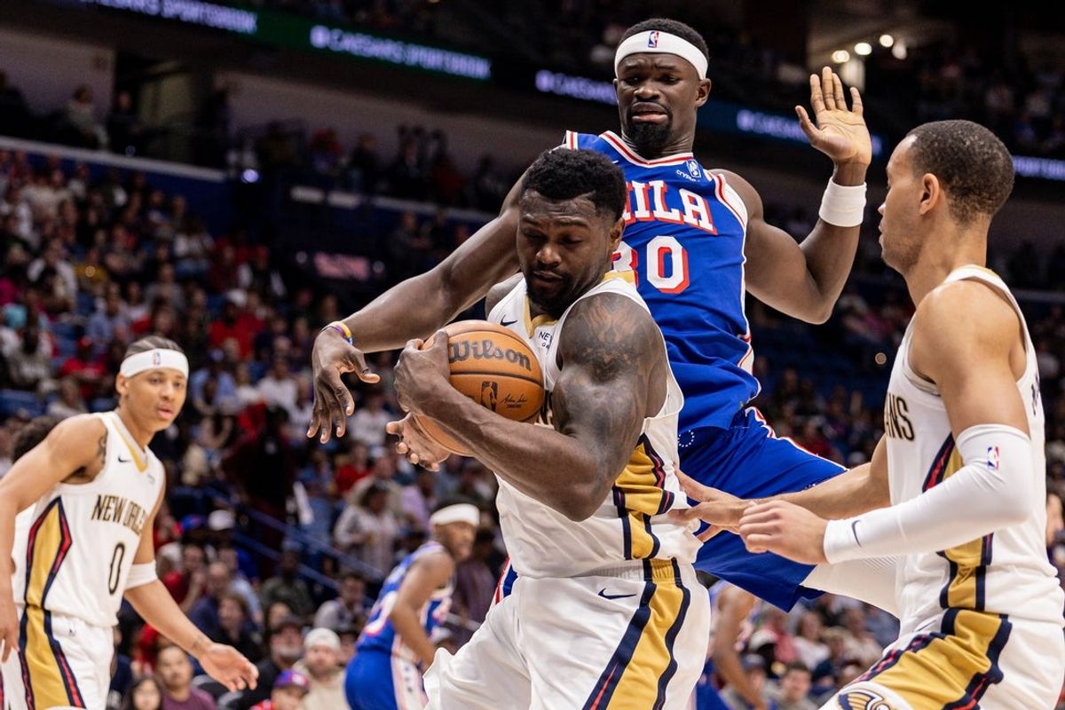 Feb 21, 2026; New Orleans, Louisiana, USA;  New Orleans Pelicans forward Zion Williamson (1) grabs a rebound from Philadelphia 76ers center Adem Bona (30) during the first half at Smoothie King Center. Mandatory Credit: Stephen Lew-Imagn Images