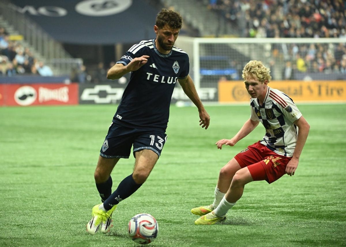 Feb 21, 2026; Vancouver, British Columbia, CAN; Vancouver Whitecaps forward Thomas Muller (13) controls the ball against Real Salt Lake midfielder Luca Moisa (34) during the first half at BC Place. Mandatory Credit: Simon Fearn-Imagn Images