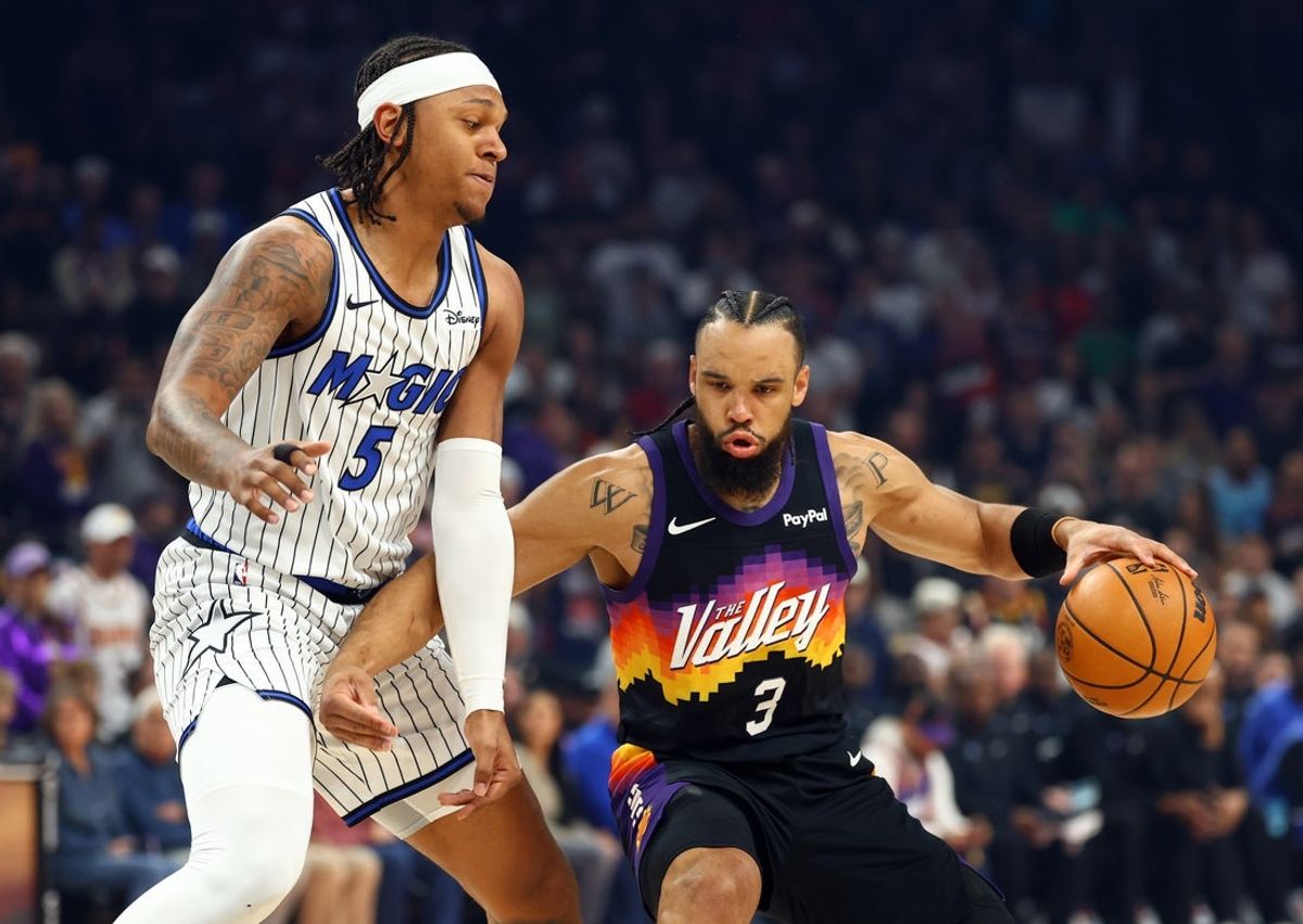 Feb 21, 2026; Phoenix, Arizona, USA; Phoenix Suns forward Dillon Brooks (3) against Orlando Magic forward Paolo Banchero (5) in the first half at Mortgage Matchup Center. Mandatory Credit: Mark J. Rebilas-Imagn Images
