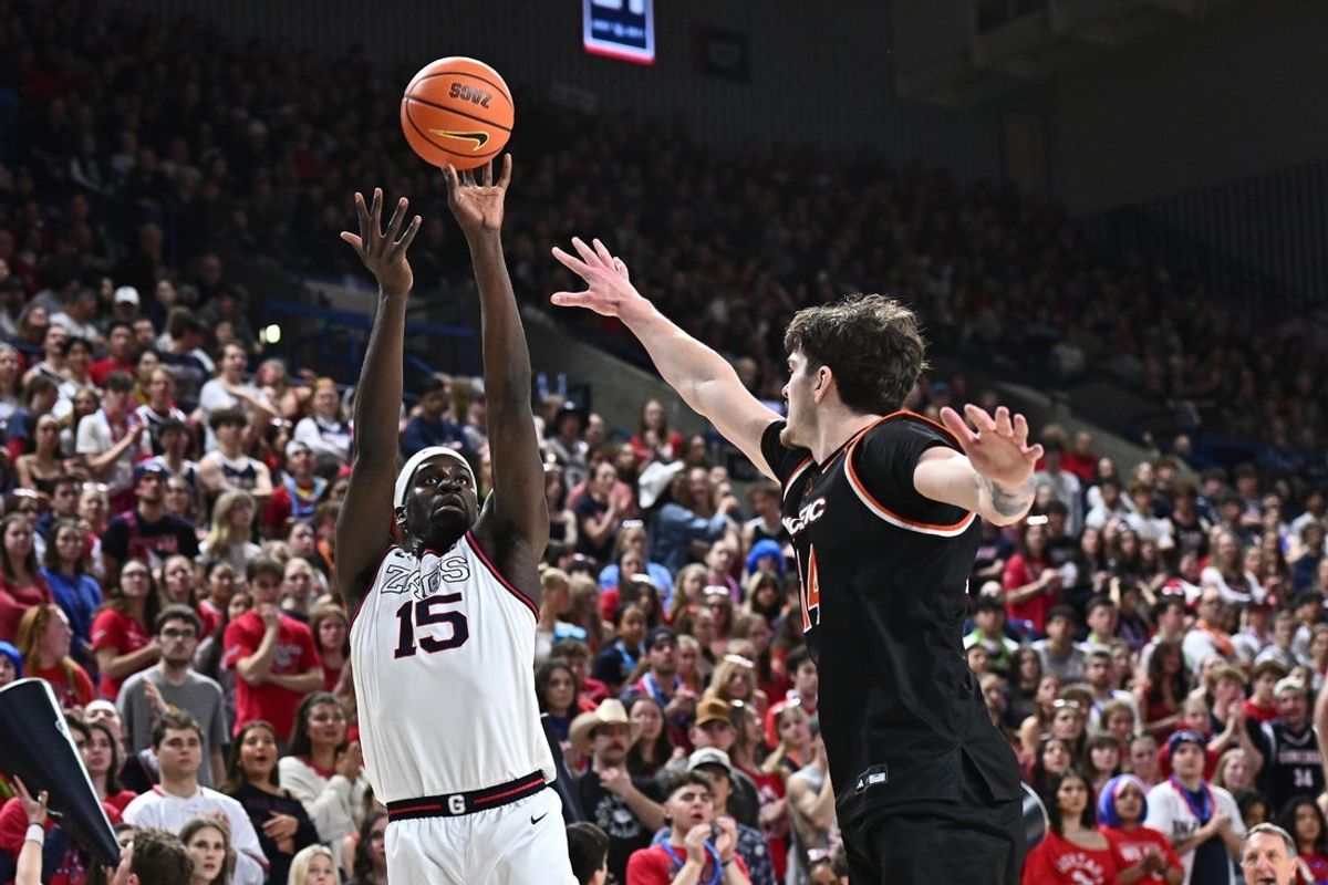 Feb 21, 2026; Spokane, Washington, USA; Gonzaga Bulldogs forward Graham Ike (15) shoots the ball against Pacific Tigers center Isaac Jack (14) in the first half at McCarthey Athletic Center. Mandatory Credit: James Snook-Imagn Images