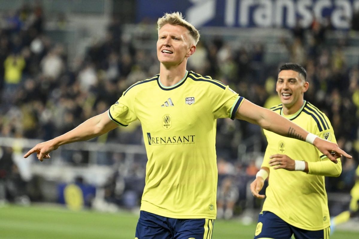 Feb 21, 2026; Nashville, Tennessee, USA;  Nashville SC forward Sam Surridge (9) celebrates his goal against New England Revolution during first half at Geodis Park. Mandatory Credit: Steve Roberts-Imagn Images