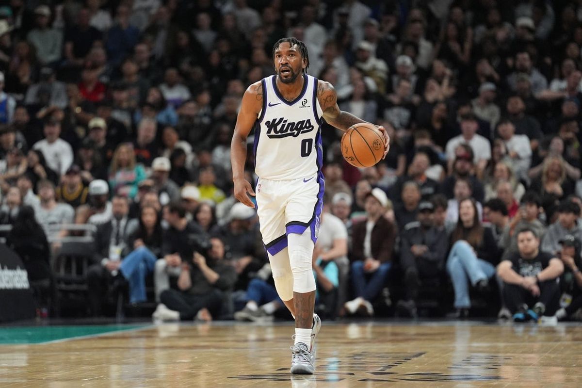 Feb 21, 2026; Austin, Texas, USA;  Sacramento Kings guard Malik Monk (0) dribbles up the court in the second half against the San Antonio Spurs at Moody Center. Mandatory Credit: Daniel Dunn-Imagn Images