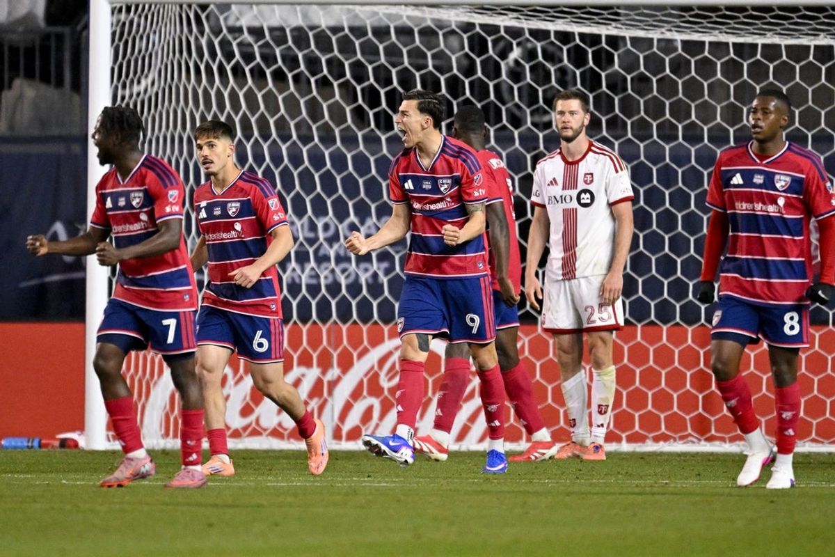 Feb 21, 2026; Frisco, Texas, USA; FC Dallas forward Petar Musa (9) celebrates the win as Toronto FC defender Walker Zimmerman (25) looks on during the second half at Toyota Stadium. Mandatory Credit: Jerome Miron-Imagn Images