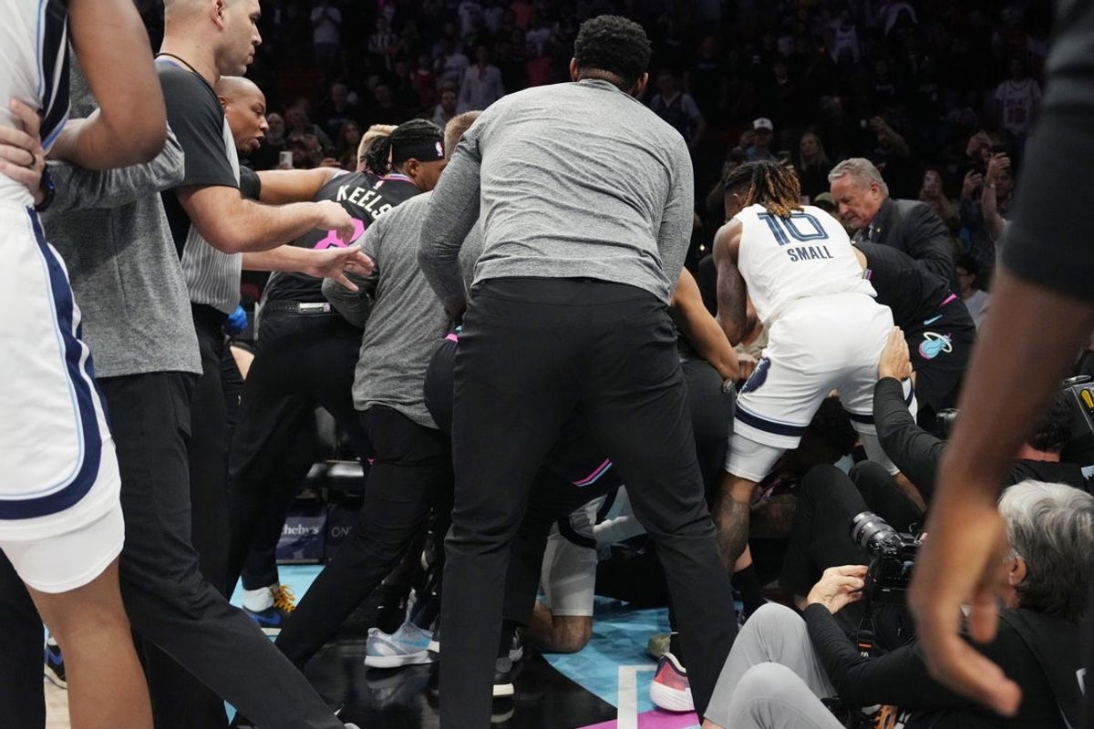 Feb 21, 2026; Miami, Florida, USA;  A fight breaks out late in the game between Miami Heat forward Myron Gardner (15) and Memphis Grizzlies guard Scotty Pippen Jr. (1) at Kaseya Center. Mandatory Credit: Jim Rassol-Imagn Images