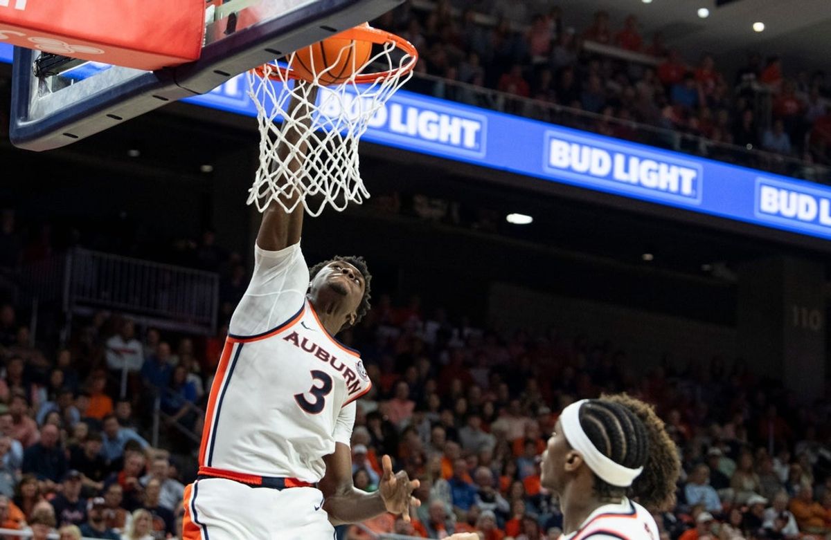 Auburn Tigers forward KeShawn Murphy (3) dunks the ball as Auburn Tigers take on Kentucky Wildcats at Neville Arena in Auburn, Ala. on Saturday, Feb. 21, 2026. Auburn Tigers defeated Kentucky Wildcats 75-74.