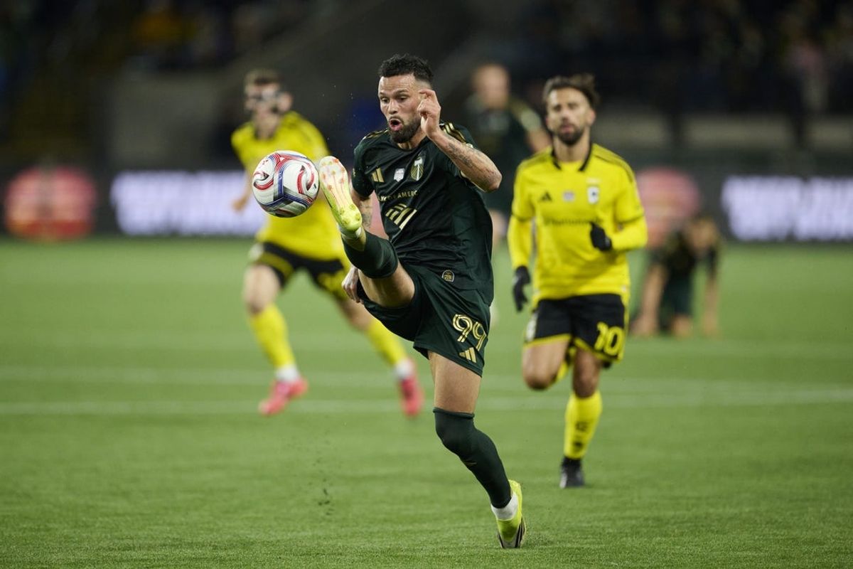 Feb 21, 2026; Portland, Oregon, USA; Portland Timbers forward Kristoffer Velde (99) controls a pass during the first half against Columbus Crew forward Diego Rossi (10) at Providence Park. Mandatory Credit: Troy Wayrynen-Imagn Images