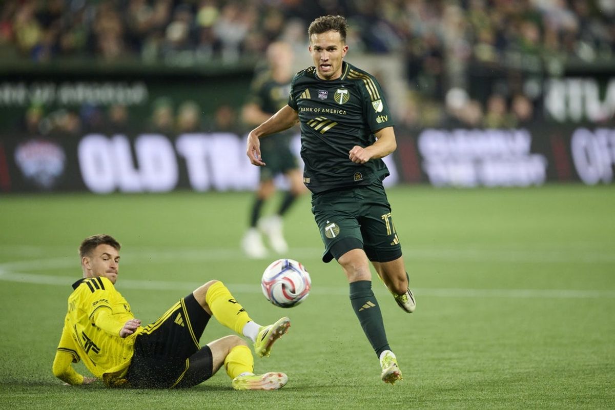 Feb 21, 2026; Portland, Oregon, USA; Portland Timbers midfielder Cole Bassett (17) chases after the ball during the first half against Columbus Crew midfielder Amar Sejdic (14) at Providence Park. Mandatory Credit: Troy Wayrynen-Imagn Images