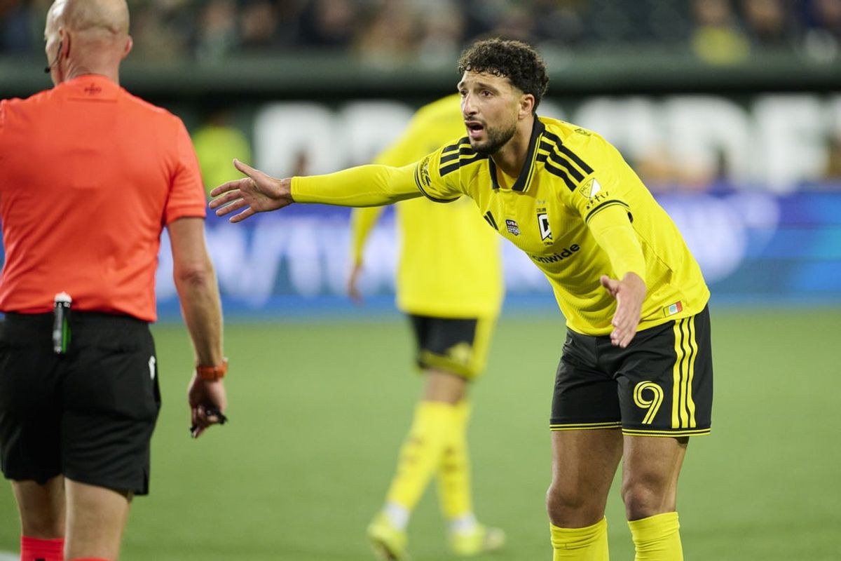 Feb 21, 2026; Portland, Oregon, USA; Columbus Crew forward Wessam Abou Ali (9) reacts to an officials call during the second half against the Portland Timbers at Providence Park. Mandatory Credit: Troy Wayrynen-Imagn Images