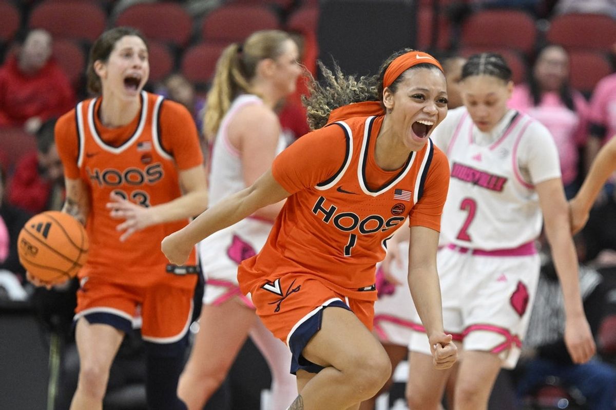 Feb 22, 2026; Louisville, Kentucky, USA;  Louisville Cardinals guard Reyna Scott (1) celebrates after time expires against the Louisville Cardinals at KFC Yum! Center.  Mandatory Credit: Jamie Rhodes-Imagn Images