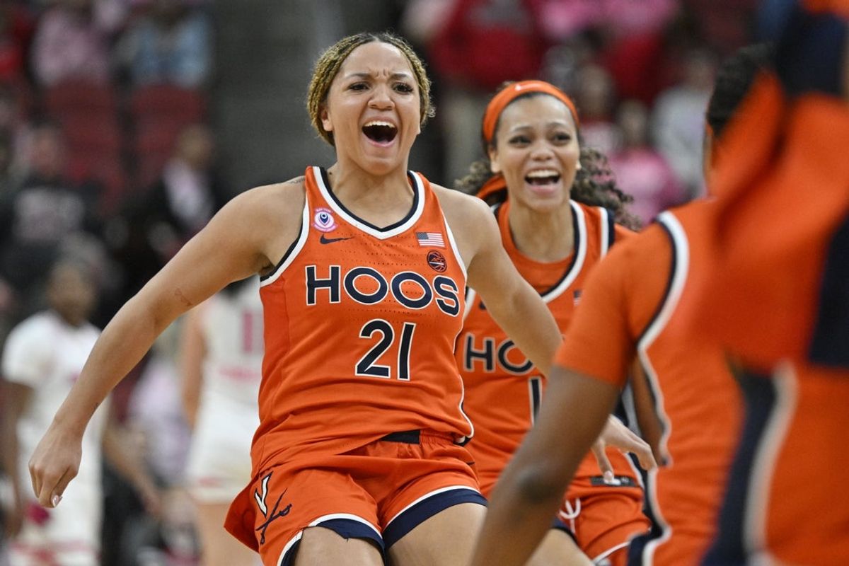 Feb 22, 2026; Louisville, Kentucky, USA;  Virginia Cavaliers guard Kymora Johnson (21) celebrates after time expires against the Louisville Cardinals during the second half at KFC Yum! Center.  Mandatory Credit: Jamie Rhodes-Imagn Images