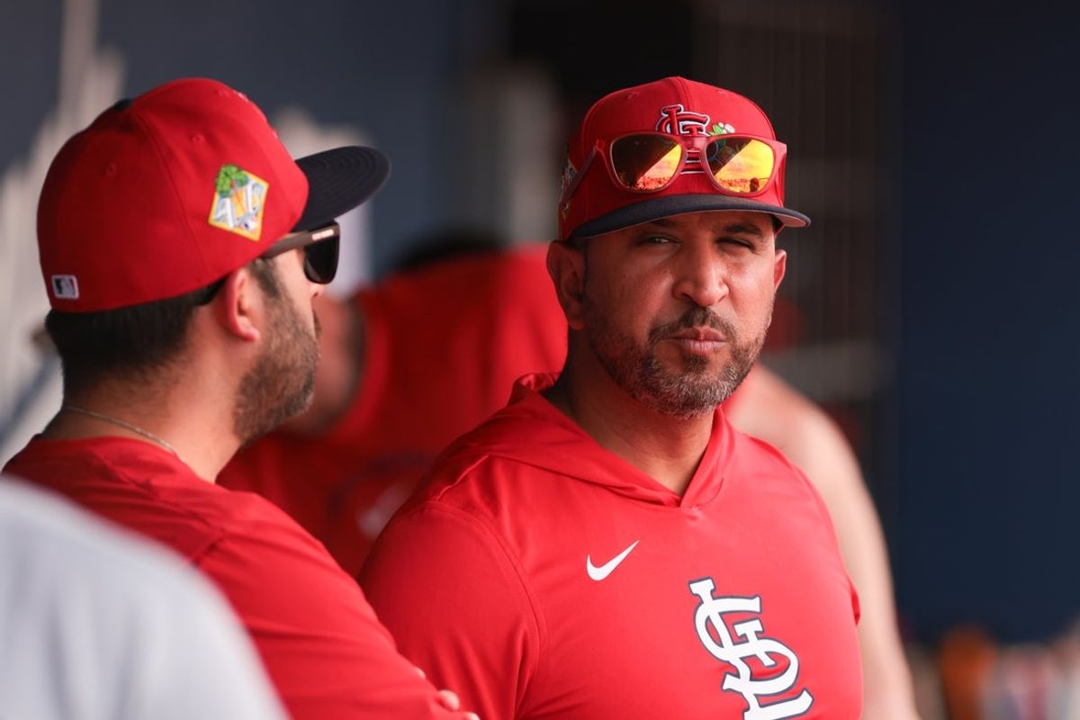 Feb 22, 2026; West Palm Beach, Florida, USA; St. Louis Cardinals manager Oliver Marmol (37) looks on from inside the dugout against the Houston Astros during the fifth inning at CACTI Park of the Palm Beaches. Mandatory Credit: Sam Navarro-Imagn Images