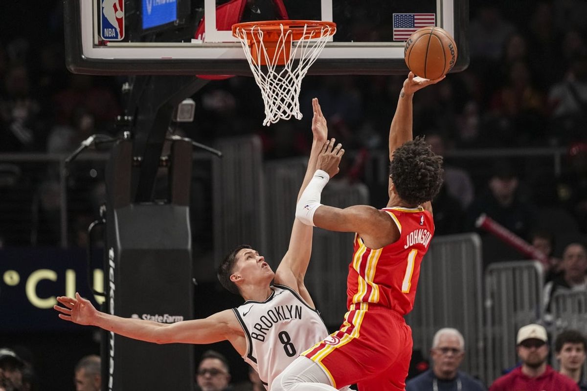 Feb 22, 2026; Atlanta, Georgia, USA; Brooklyn Nets guard Egor Demin (8) defends against Atlanta Hawks forward Jalen Johnson (1) during the first half at State Farm Arena. Mandatory Credit: Dale Zanine-Imagn Images