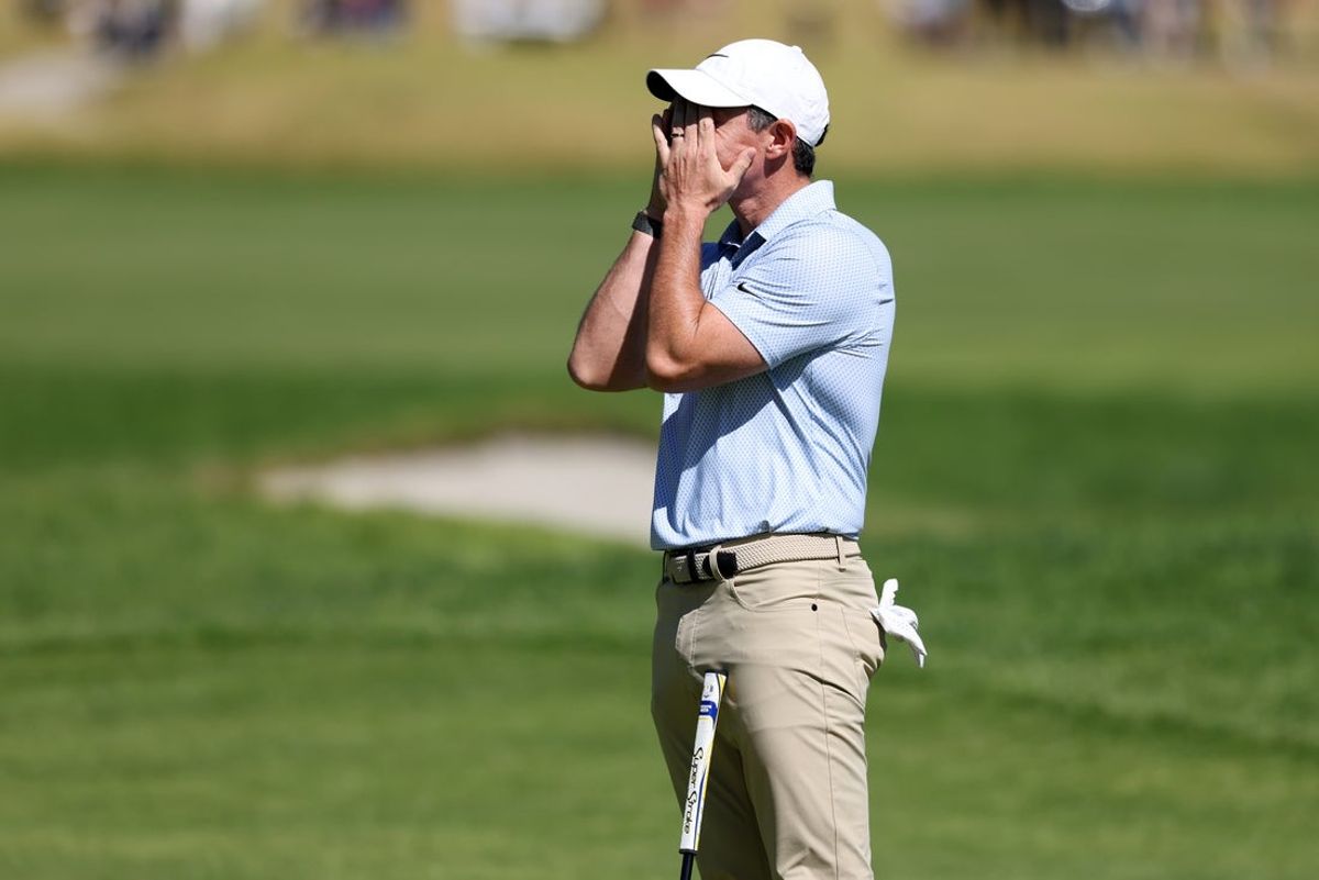 Feb 22, 2026; Pacific Palisades, California, USA;  Rory McIlroy reacts after missing his putt on the 14th green during the final round of the The Genesis Invitational golf tournament at Riviera Country Club. Mandatory Credit: Kiyoshi Mio-Imagn Images