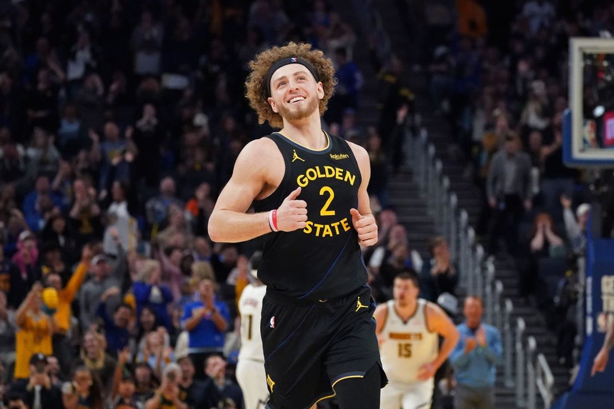 Feb 22, 2026; San Francisco, California, USA;  Golden State Warriors guard Brandin Podziemski (2) smiles after scoring against the Denver Nuggets in the fourth quarter at Chase Center. Mandatory Credit: David Gonzales-Imagn Images