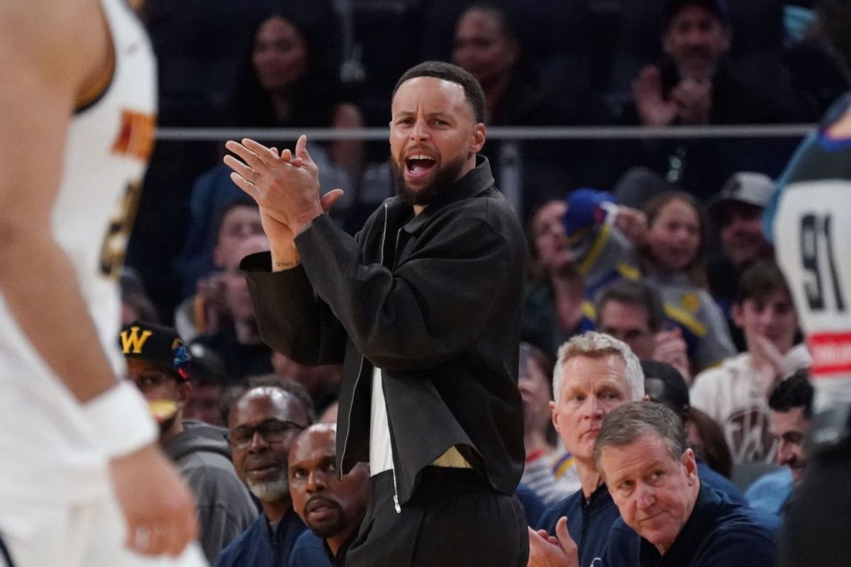 Feb 22, 2026; San Francisco, California, USA;  Golden State Warriors guard Stephen Curry (30) cheers from the bench during a game against the Denver Nuggets in the third quarter at Chase Center. Mandatory Credit: David Gonzales-Imagn Images