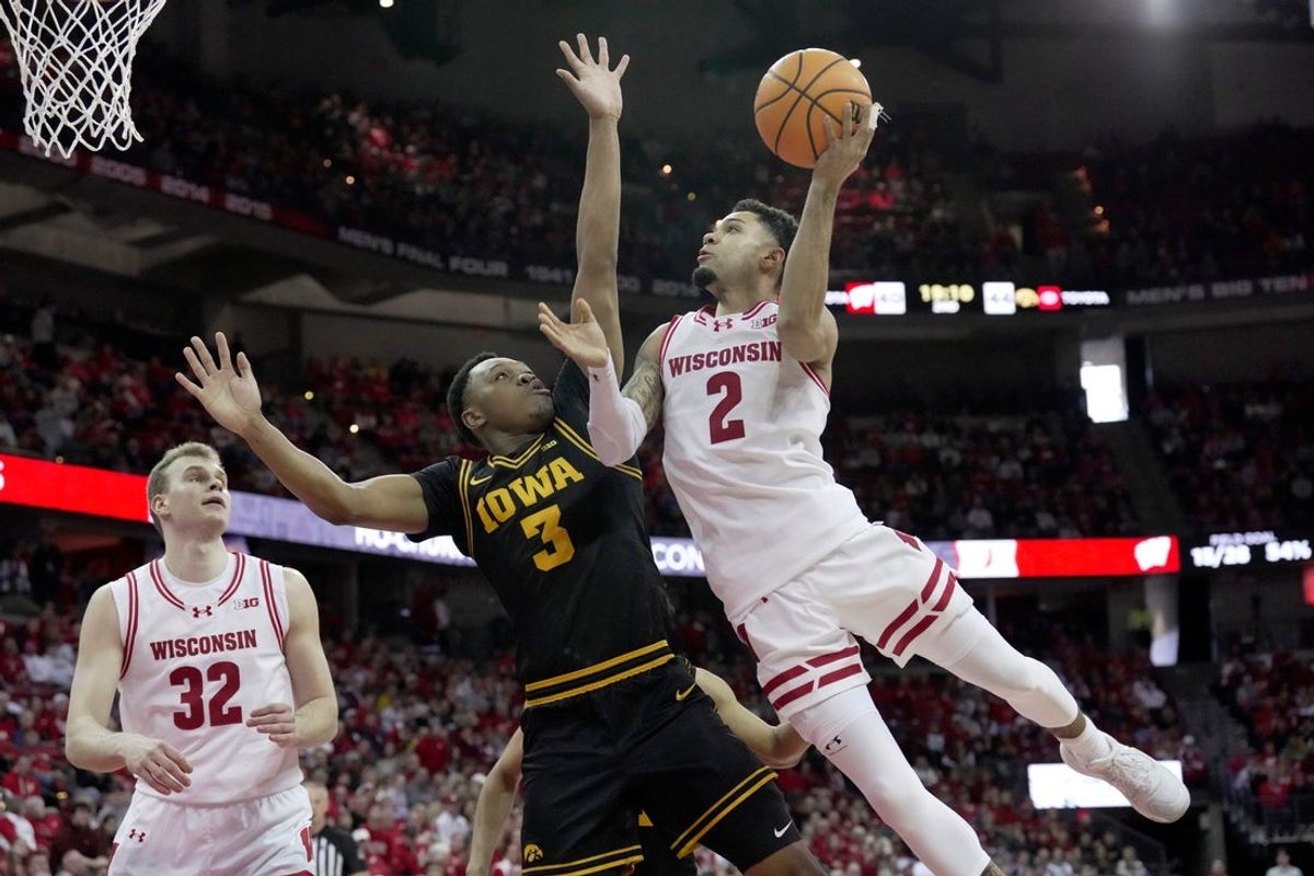 Wisconsin guard Nick Boyd scores against Iowa forward Cam Manyawu during the second half on Sunday, Feb. 22 at the Kohl Center in Madison.