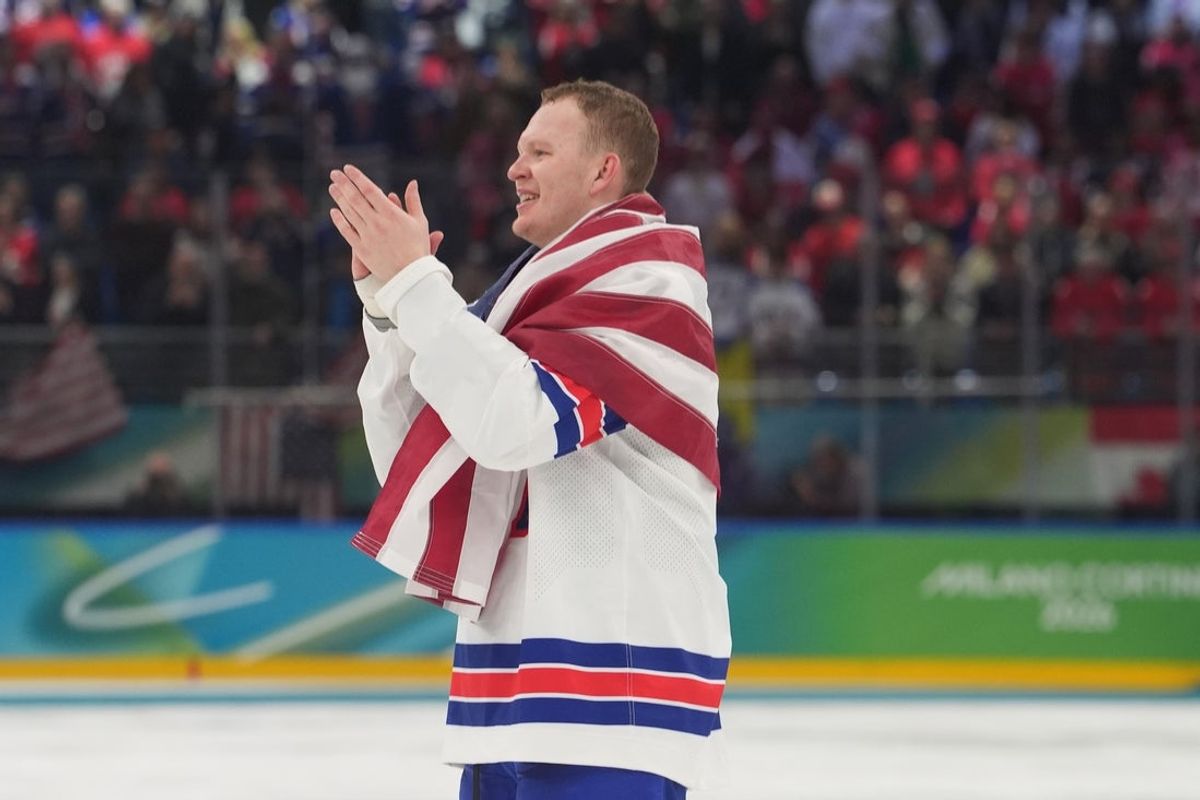 Feb 22, 2026; Milan, Italy; Brady Tkachuk (7) of the United States celebrates after defeating Canada in the men's ice hockey gold medal game during the Milano Cortina 2026 Olympic Winter Games at Milano Santagiulia Ice Hockey Arena. Mandatory Credit: Amber Searls-Imagn Images