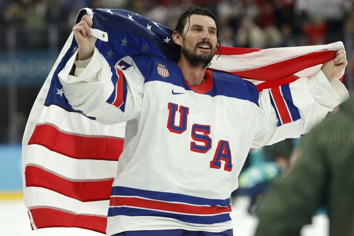 Feb 22, 2026; Milan, Italy; Connor Hellebuyck #37 of Team United States celebrates after winning the goal medal game against Team Canada during the Milano Cortina 2026 Olympic Winter Games at Milano Santagiulia Ice Hockey Arena. Mandatory Credit: Geoff Burke-Imagn Images