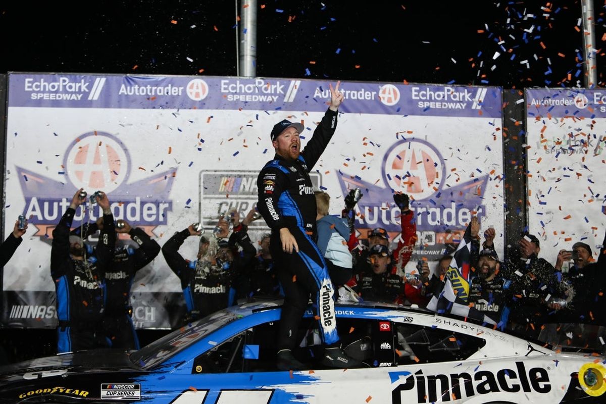 Feb 22, 2026; Hampton, Georgia, USA;  NASCAR Cup Series driver Tyler Reddick celebrates the win at EchoPark Speedway. Mandatory Credit: Mady Mertens-Imagn Images