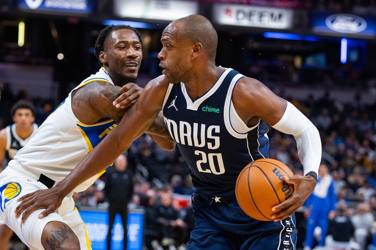 Feb 22, 2026; Indianapolis, Indiana, USA;  Dallas Mavericks forward Khris Middleton (20) dribbles the ball while Indiana Pacers guard Quenton Jackson (29) defends in the second half at Gainbridge Fieldhouse. Mandatory Credit: Trevor Ruszkowski-Imagn Images
