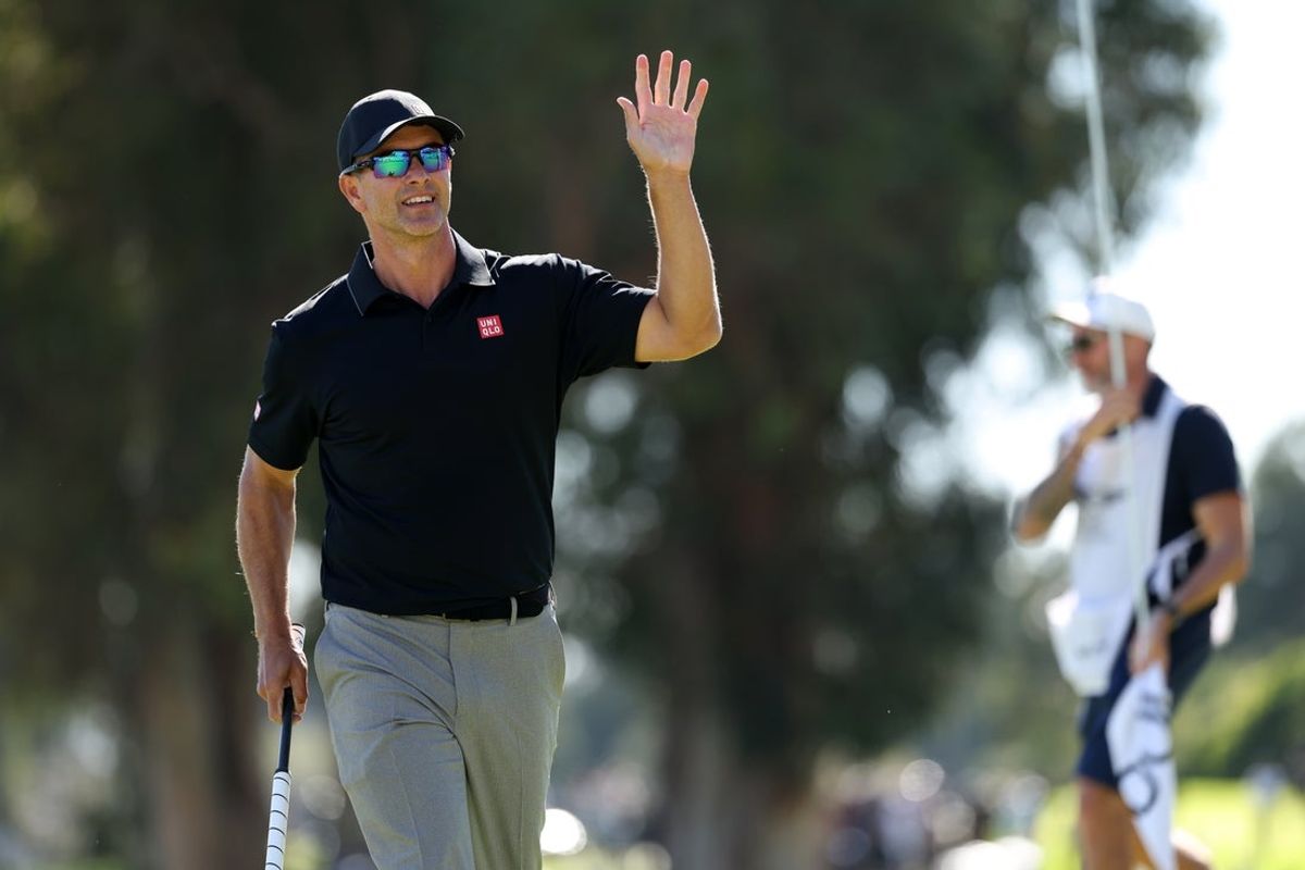 Feb 22, 2026; Pacific Palisades, California, USA;  Adam Scott acknowledges the crowd after making a birdie putt on the 18th green during the final round of the The Genesis Invitational golf tournament at Riviera Country Club. Mandatory Credit: Kiyoshi Mio-Imagn Images