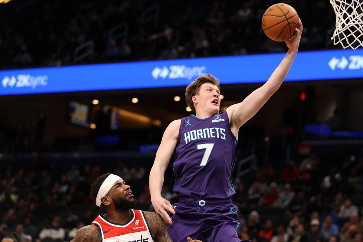 Feb 22, 2026; Washington, District of Columbia, USA; Charlotte Hornets guard Kon Knueppel (7) takes a shot over Washington Wizards guard Jaden Hardy (8) during the second half at Capital One Arena. Mandatory Credit: Daniel Kucin Jr.-Imagn Images