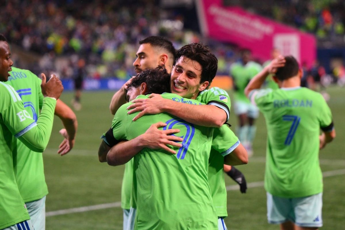 Feb 22, 2026; Seattle, Washington, USA; Seattle Sounders FC forward Paul Rothrock (14) hugs Seattle Sounders FC forward Jesus Ferreira (9) after Rothrock scored a goal against Colorado Rapids during the second half at Lumen Field. Mandatory Credit: Steven Bisig-Imagn Images