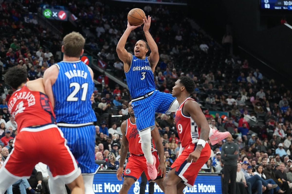 Feb 22, 2026; Inglewood, California, USA; Orlando Magic guard Desmond Bane (3) shoots the ball against LA Clippers forward Kawhi Leonard (2) and guard Bennedict Mathurin (9) in the second half at Intuit Dome. Mandatory Credit: Kirby Lee-Imagn Images