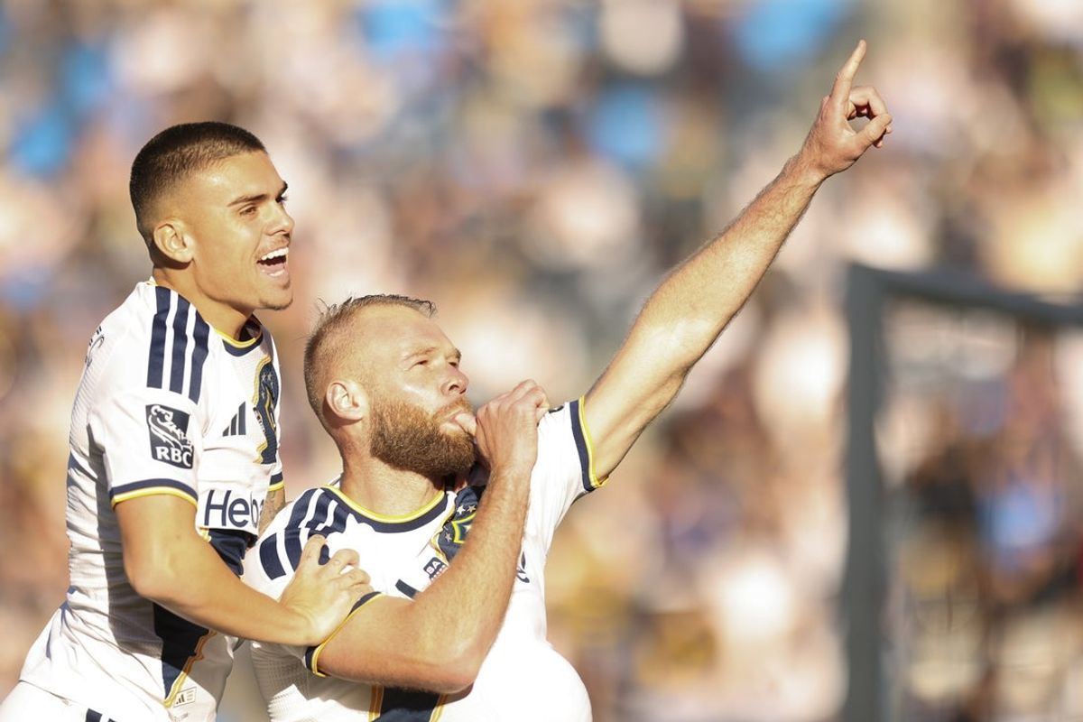 Feb 22, 2026; Carson, California, USA; LA Galaxy forward forward Joao Klauss (99) celebrates his goal against New York City FC with teammate forward Gabriel Pec (11) at Dignity Health Sports Park. Mandatory Credit: William Navarro-Imagn Images