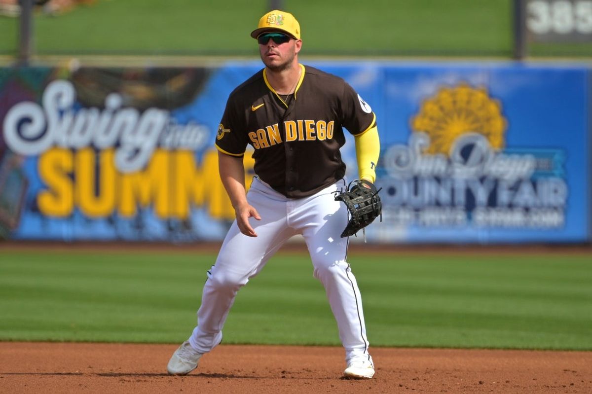 Feb 23, 2026; Peoria, Arizona, USA;  San Diego Padres first baseman Ty France (4) gets set in the first inning against the Milwaukee Brewers at Peoria Sports Complex. Mandatory Credit: Jayne Kamin-Oncea-Imagn Images