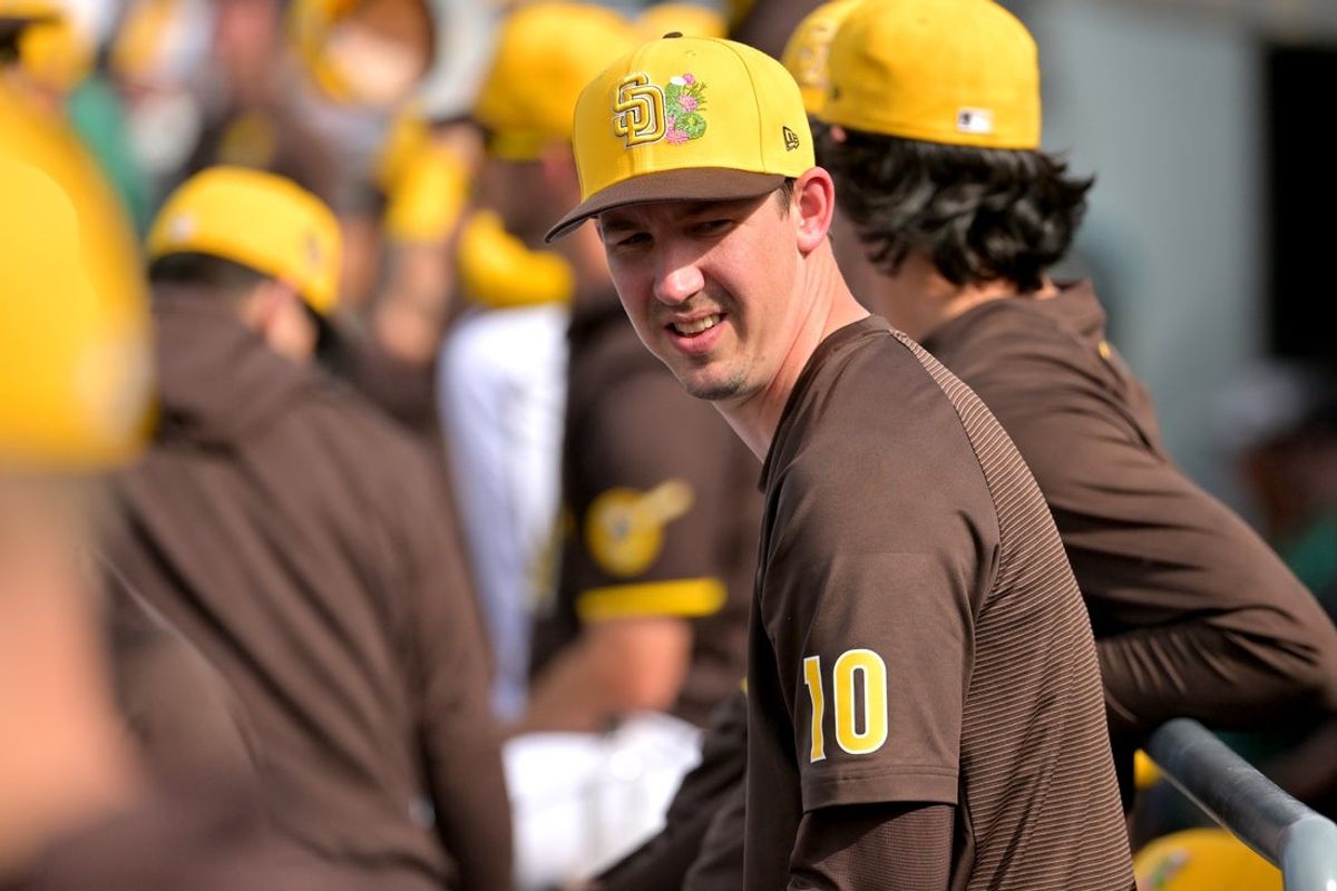 Feb 23, 2026; Peoria, Arizona, USA;  San Diego Padres pitcher Walker Buehler (10) looks on from the dugout in the fifth inning against the Milwaukee Brewers at Peoria Sports Complex. Mandatory Credit: Jayne Kamin-Oncea-Imagn Images