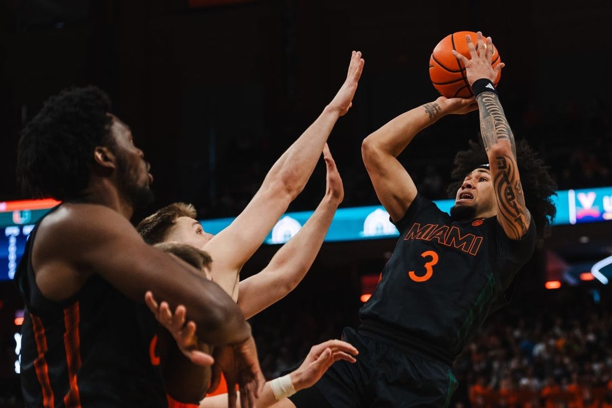 Feb 21, 2026; Charlottesville, Virginia, USA; Miami (FL) Hurricanes guard Tre Donaldson (3) shoots the ball while Virginia Cavaliers forward Thijs de Ridder (28) defends during the first half at John Paul Jones Arena. Mandatory Credit: Emily Faith Morgan-Imagn Images