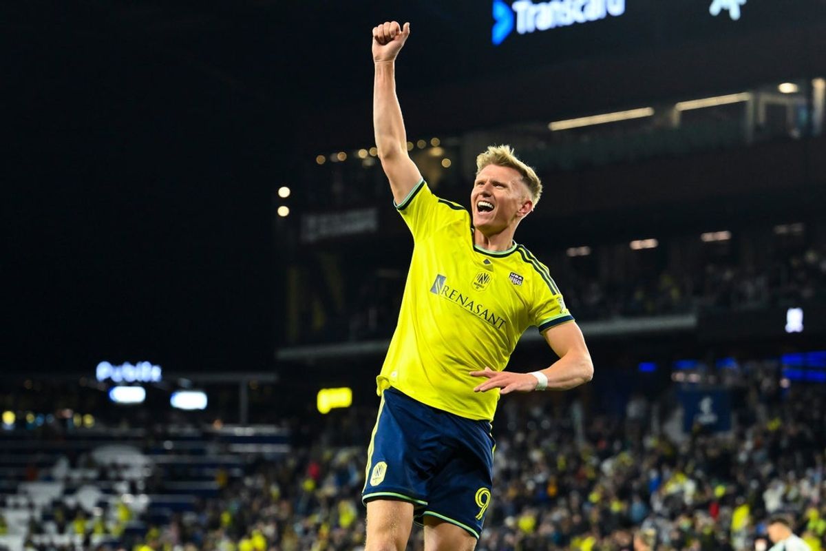 Feb 21, 2026; Nashville, Tennessee, USA;  Nashville SC forward Sam Surridge (9) celebrates his goal  against New England Revolution during first half at Geodis Park. Mandatory Credit: Steve Roberts-Imagn Images