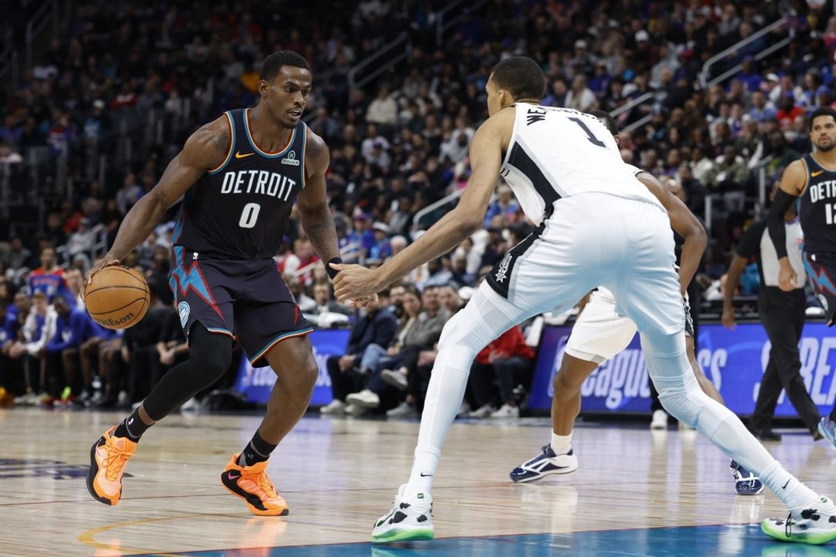 Feb 23, 2026; Detroit, Michigan, USA;  Detroit Pistons center Jalen Duren (0) is defended by San Antonio Spurs forward Victor Wembanyama (1) in the second half at Little Caesars Arena. Mandatory Credit: Rick Osentoski-Imagn Images