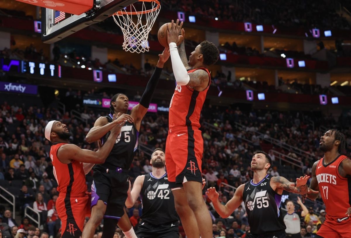 Feb 23, 2026; Houston, Texas, USA; Houston Rockets forward Jabari Smith Jr. (10) grabs a defensive rebound against Utah Jazz forward Cody Williams (5)  in the second quarter at Toyota Center. Mandatory Credit: Thomas Shea-Imagn Images