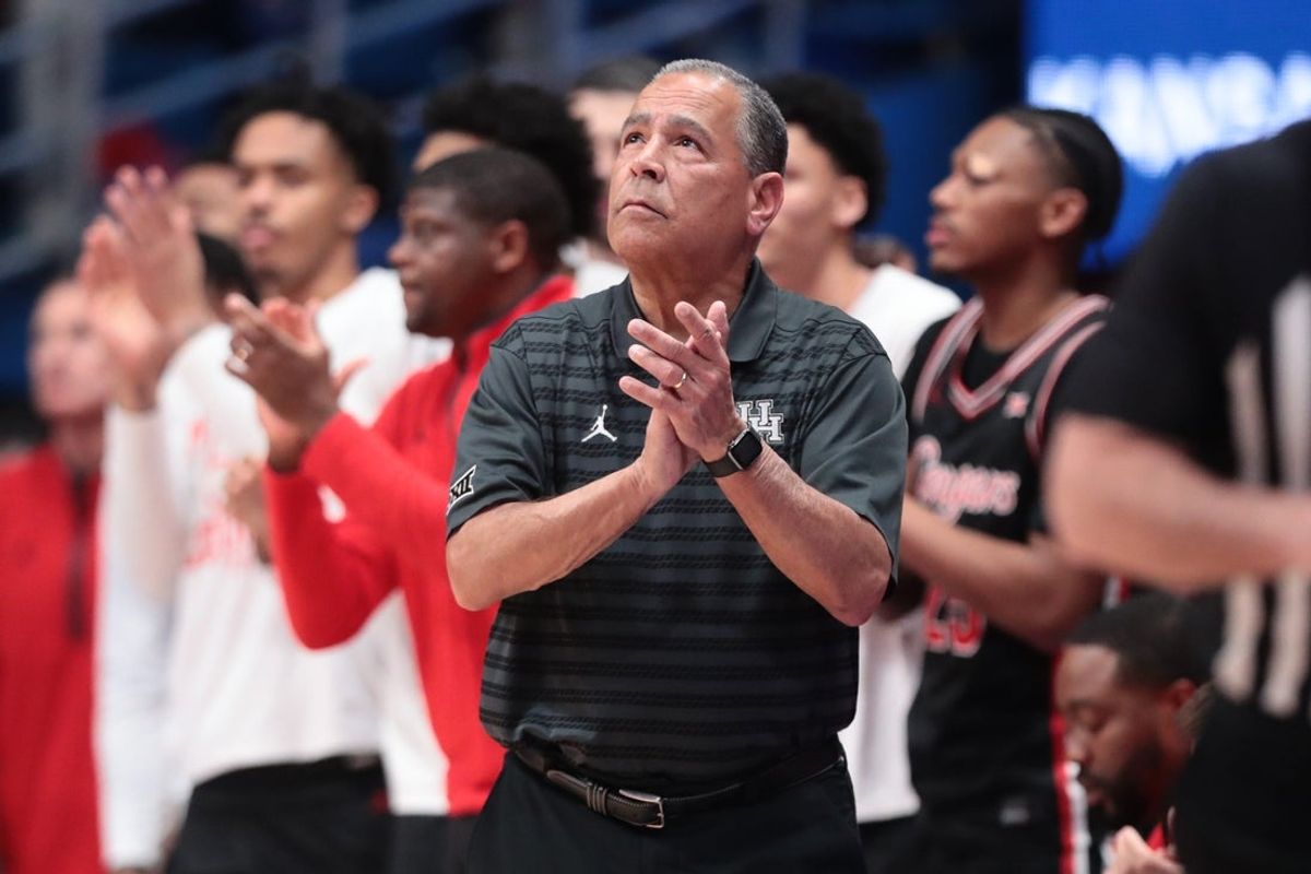Houston Cougars head coach Kelvin Sampson applauds a play against Kansas Jayhawks during the game inside Allen Fieldhouse on Monday, Feb. 23, 2026.