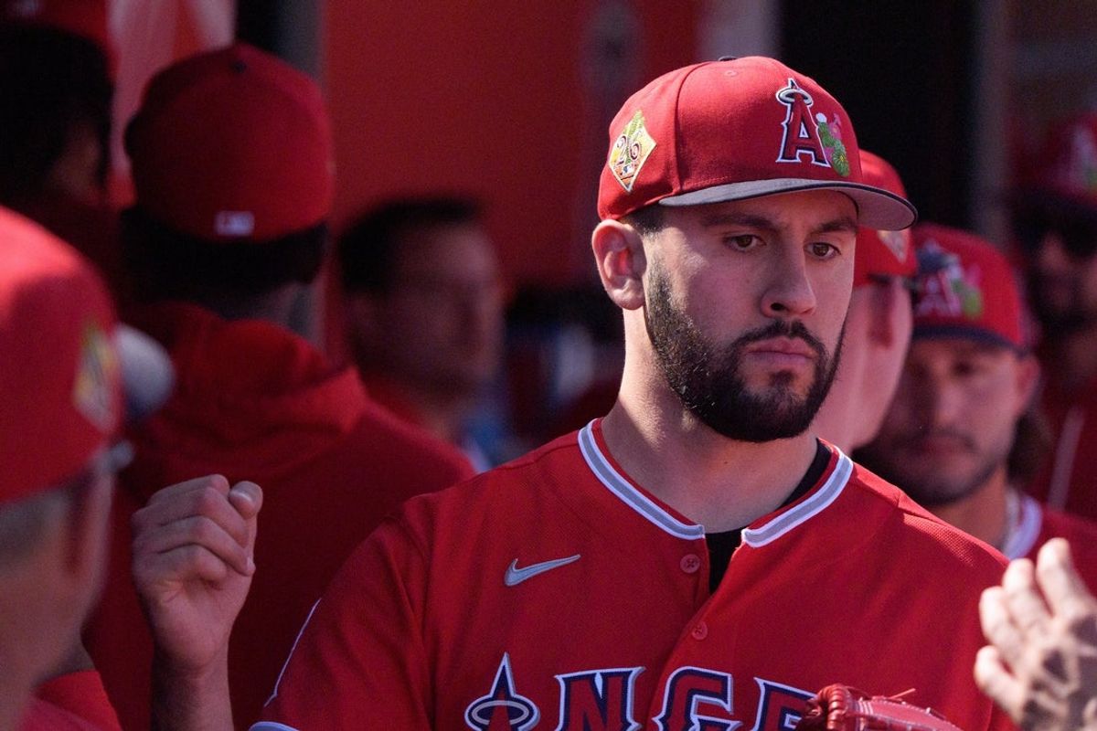 Feb 24, 2026; Tempe, Arizona, USA; Los Angeles Angels pitcher Grayson Rodriguez (21) reacts in the dugout with his team after being relieved in the second inning against the San Francisco Giants during a spring training game at Tempe Diablo Stadium. Mandatory Credit: Allan Henry-Imagn Images