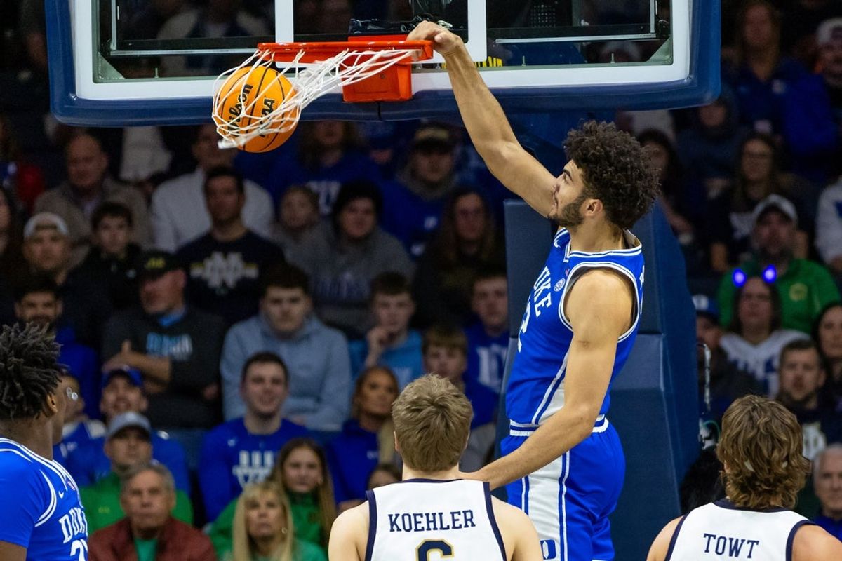 Feb 24, 2026; South Bend, Indiana, USA; Duke Blue Devils forward Cameron Boozer (12) dunks against the Notre Dame Fighting Irish during the first half at Purcell Pavilion at the Joyce Center. Mandatory Credit: Michael Caterina-Imagn Images