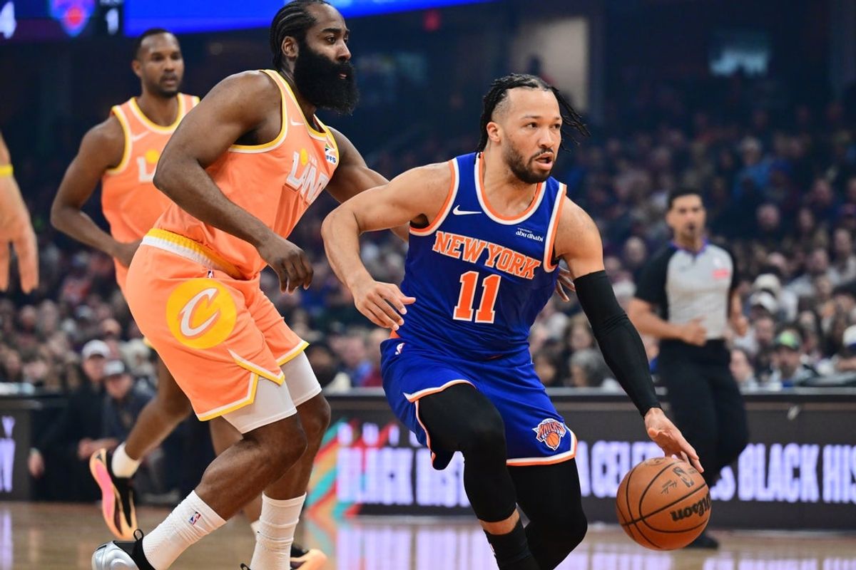 Feb 24, 2026; Cleveland, Ohio, USA; New York Knicks guard Jalen Brunson (11) drives to the basket against Cleveland Cavaliers guard James Harden (1) during the first quarter at Rocket Arena. Mandatory Credit: Ken Blaze-Imagn Images