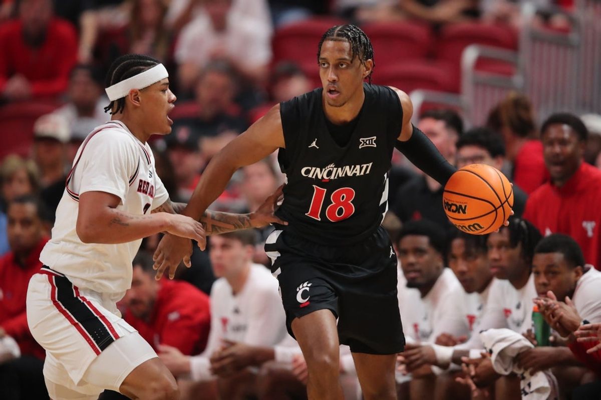 Feb 24, 2026; Lubbock, Texas, USA;  Cincinnati Bearcats forward Baba Miller (18) dribbles against Texas Tech Red Raiders forward LeJuan Watts (3) in the first half at United Supermarkets Arena. Mandatory Credit: Michael C. Johnson-Imagn Images