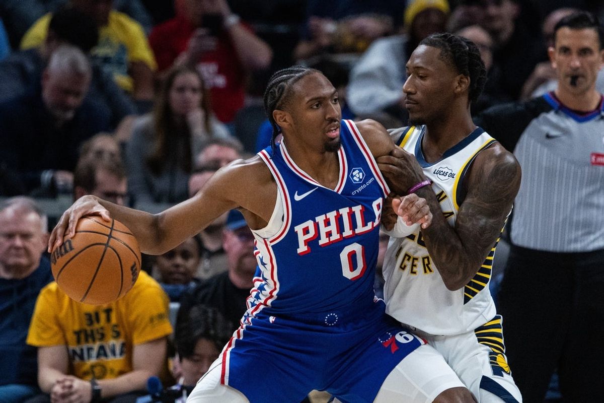 Feb 24, 2026; Indianapolis, Indiana, USA; Philadelphia 76ers guard Tyrese Maxey (0) dribbles the ball while Indiana Pacers guard Quenton Jackson (29) defends in the first half at Gainbridge Fieldhouse. Mandatory Credit: Trevor Ruszkowski-Imagn Images