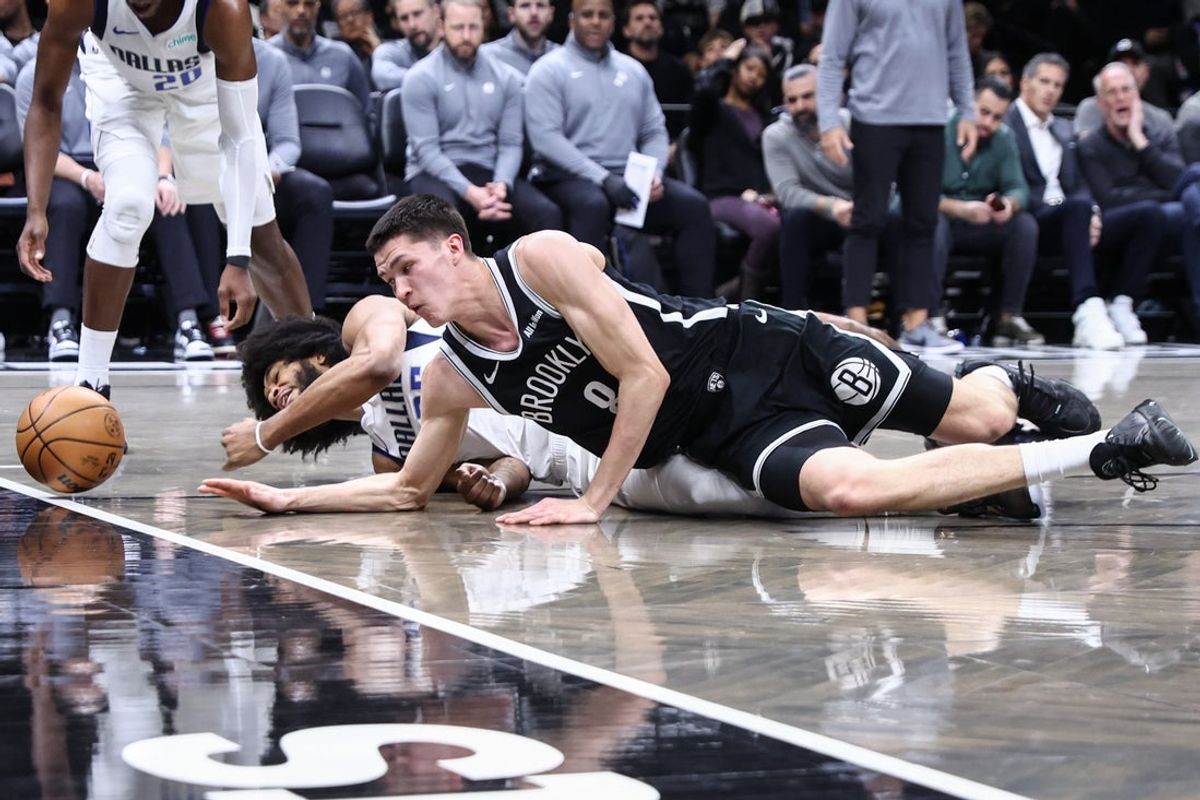 Feb 24, 2026; Brooklyn, New York, USA;  Brooklyn Nets guard Egor Demin (8) and Dallas Mavericks forward Marvin Bagley III (35) fight for a loose ball in the first quarter at Barclays Center. Mandatory Credit: Wendell Cruz-Imagn Images
