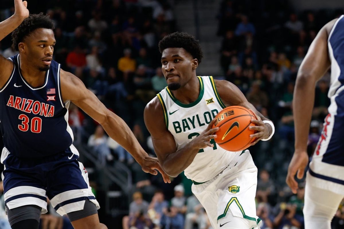 Feb 24, 2026; Waco, Texas, USA;  Baylor Bears guard Tounde Yessoufou (24) drives to the basket against Arizona Wildcats forward Tobe Awaka (30) during the first half at Paul and Alejandra Foster Pavilion. Mandatory Credit: Chris Jones-Imagn Images