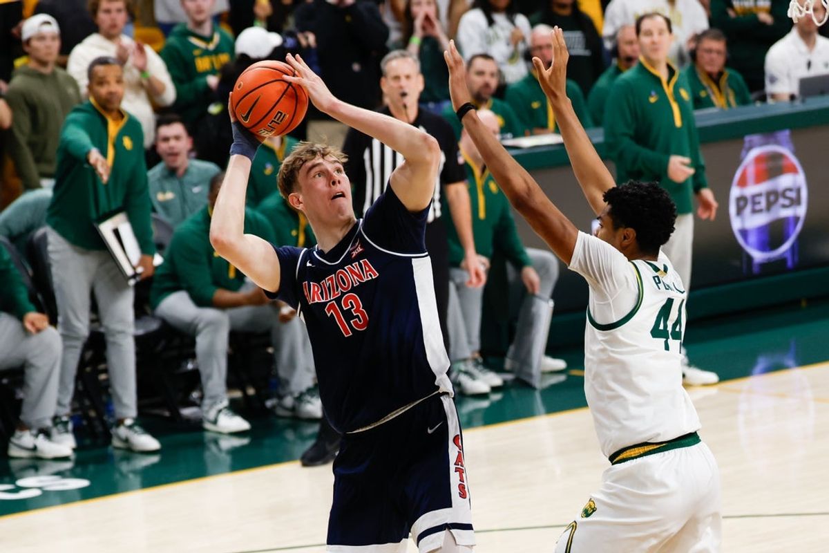 Feb 24, 2026; Waco, Texas, USA;  Arizona Wildcats center Motiejus Krivas (13) shoots as Baylor Bears center Caden Powell (44) defends during the first half at Paul and Alejandra Foster Pavilion. Mandatory Credit: Chris Jones-Imagn Images