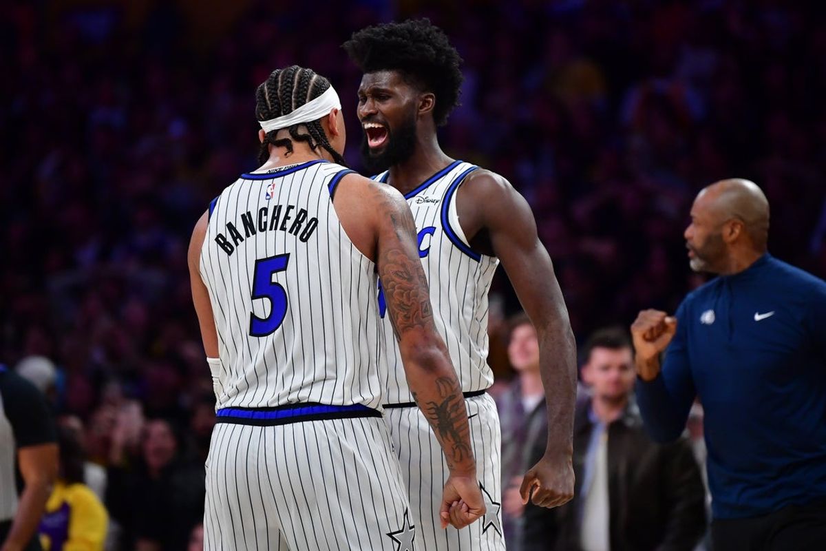 Feb 24, 2026; Los Angeles, California, USA; Orlando Magic forward Paolo Banchero (5) and forward Jonathan Isaac (1) celebrate the victory against the Los Angeles Lakers at Crypto.com Arena. Mandatory Credit: Gary A. Vasquez-Imagn Images