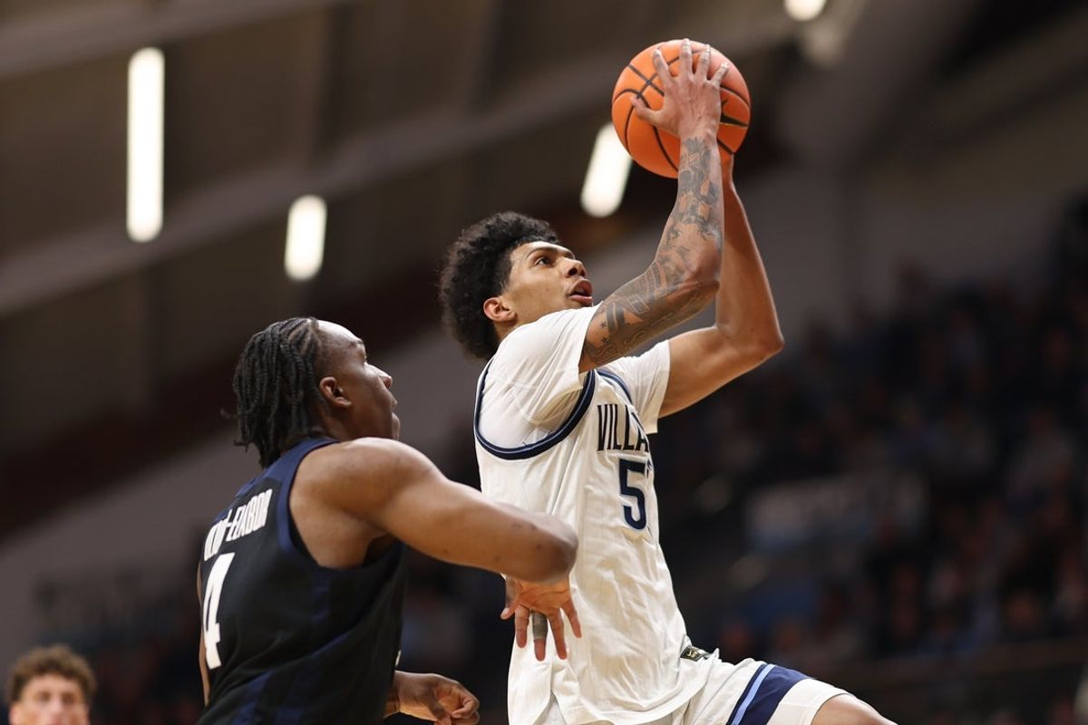 Feb 25, 2026; Villanova, Pennsylvania, USA; Villanova Wildcats guard Acaden Lewis (55) drives for a shot against Butler Bulldogs forward Efeosa Oliogu-Elabor (4) during the first half at William B. Finneran Pavilion. Mandatory Credit: Bill Streicher-Imagn Images